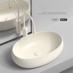 Nordic Cream-Colored Oval Countertop Basin for Home Bathroom Ceramic Washbasin Balcony Washbasin Art Basin