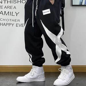 
Spring and autumn new sports pants for men, youth, trendy splicing casual pants for men, small feet, elastic waist, trendy brand harem sweatpants for men