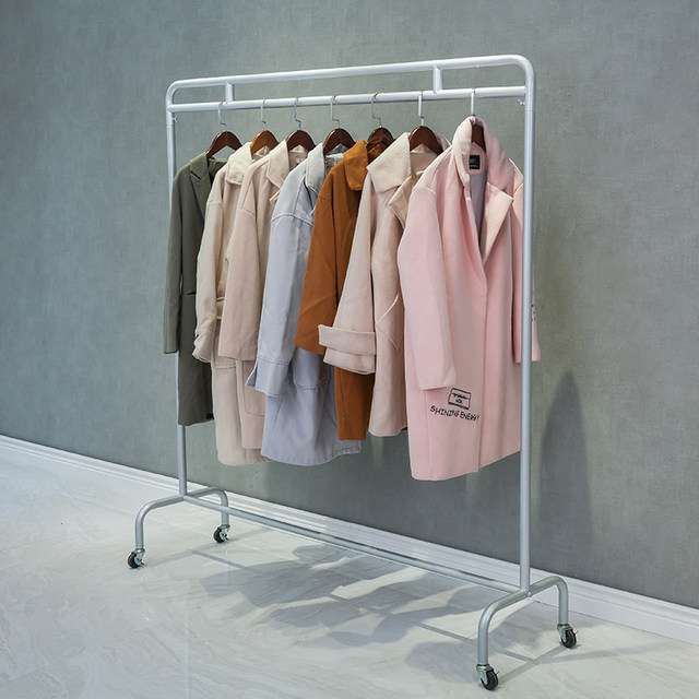 Clothing store display rack winter coat fur coat hanger wedding dress ...
