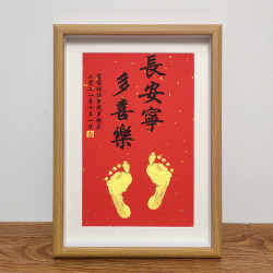 A hundred-day-old baby's hand and footprints
