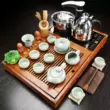 bàn trà điện thông minh cao cấp Nhỏ bằng gỗ chắc chắn tích hợp khay trà gốm gia dụng Bộ ấm trà cát tím hoàn toàn tự động cảm ứng bàn trà trà đĩa biển ấm trà điện giá rẻ Bàn trà điện