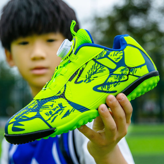 
An children's rotary buckle football shoes TF broken nail training shoes for boys and girls primary school students without tying shoelaces