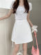 Design-sensual lace-up white skirt for women with large-size summer anti-exposure high-waisted A-line skirt irregular hip-covered short skirt
