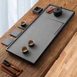 Natural black gold stone tea tray home simple whole stone large and small stone tea table living room Chinese tea sea