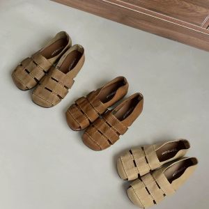 
Baotou hollow woven Roman sandals for women's new summer retro design flat-bottomed pig cage fashion sandals