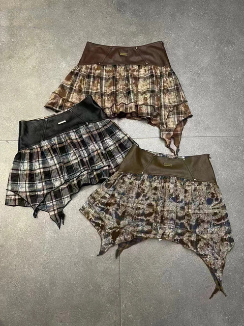 Early autumn new style of old splicing irregular PU leather skirt for female hot girl retro slim short skirt design niche