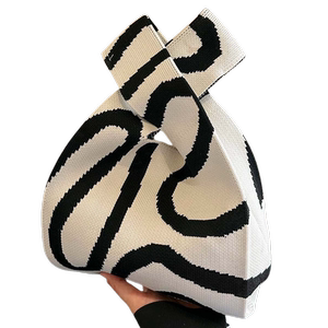 
Hand-held small bag 2026 new women's knitted niche hand-carrying wrist bag tote bag for work Korean style lunch box bag