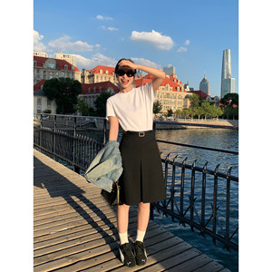 
pusumede black high-waisted A-line skirt for women 2025 autumn design Korean mid-length hip-covered skirt