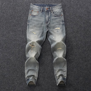
High-end European autumn and winter high-end trendy trousers with holes and old retro blue jeans for men with slim feet and elasticity