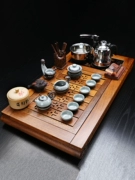 Bộ trà gỗ nguyên khối cánh gà cho phòng khách gia đình Bộ trà Kung Fu biển bốn trong một Bộ trà Trung Quốc khay trà hoàn toàn tự động