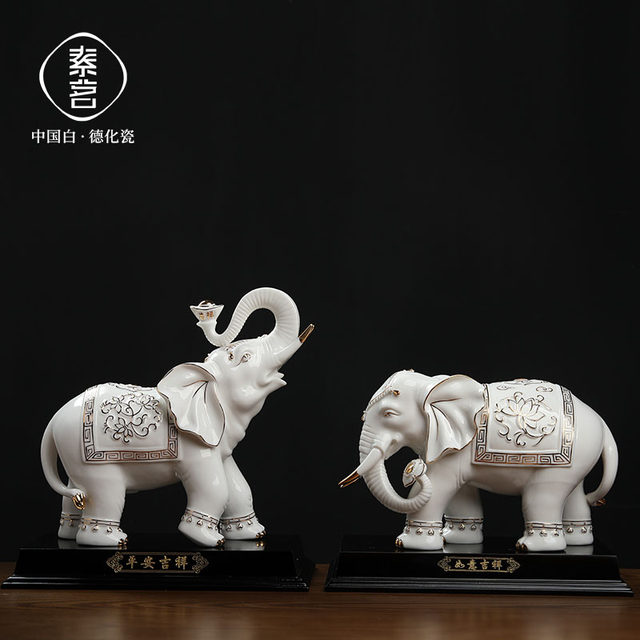 Chinese white ceramic elephant ornaments, a pair of high-end housewarming and opening gifts, living room wine cabinet, desktop fortune-enhancing decorations
