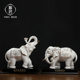 Chinese white ceramic elephant ornaments, a pair of high-end housewarming and opening gifts, living room wine cabinet, desktop fortune-enhancing decorations