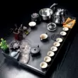 bàn trà sắt sơn tĩnh điện Bộ ấm trà Kung Fu hoàn chỉnh, khay trà đá vàng đen tại nhà, bàn trà đá phun nước chảy nguyên tử, nước sôi đơn giản, hoàn toàn tự động bán bàn trà điện Bàn trà điện