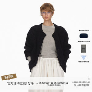 
ECHOADE is exquisite and simple, textured mixed yarn, wool knitted cardigan with raglan sleeves and dropped shoulders.