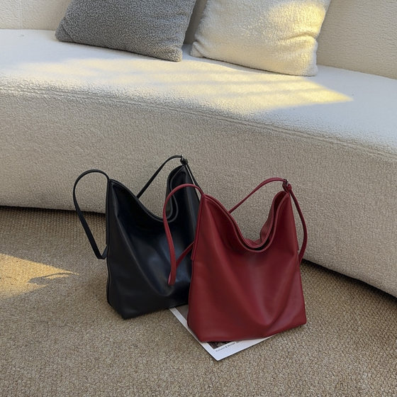 
TANGFEEL first-layer cowhide tote women's bag, simple, fashionable and versatile, large-capacity one-shoulder cross-body commuting bucket bag