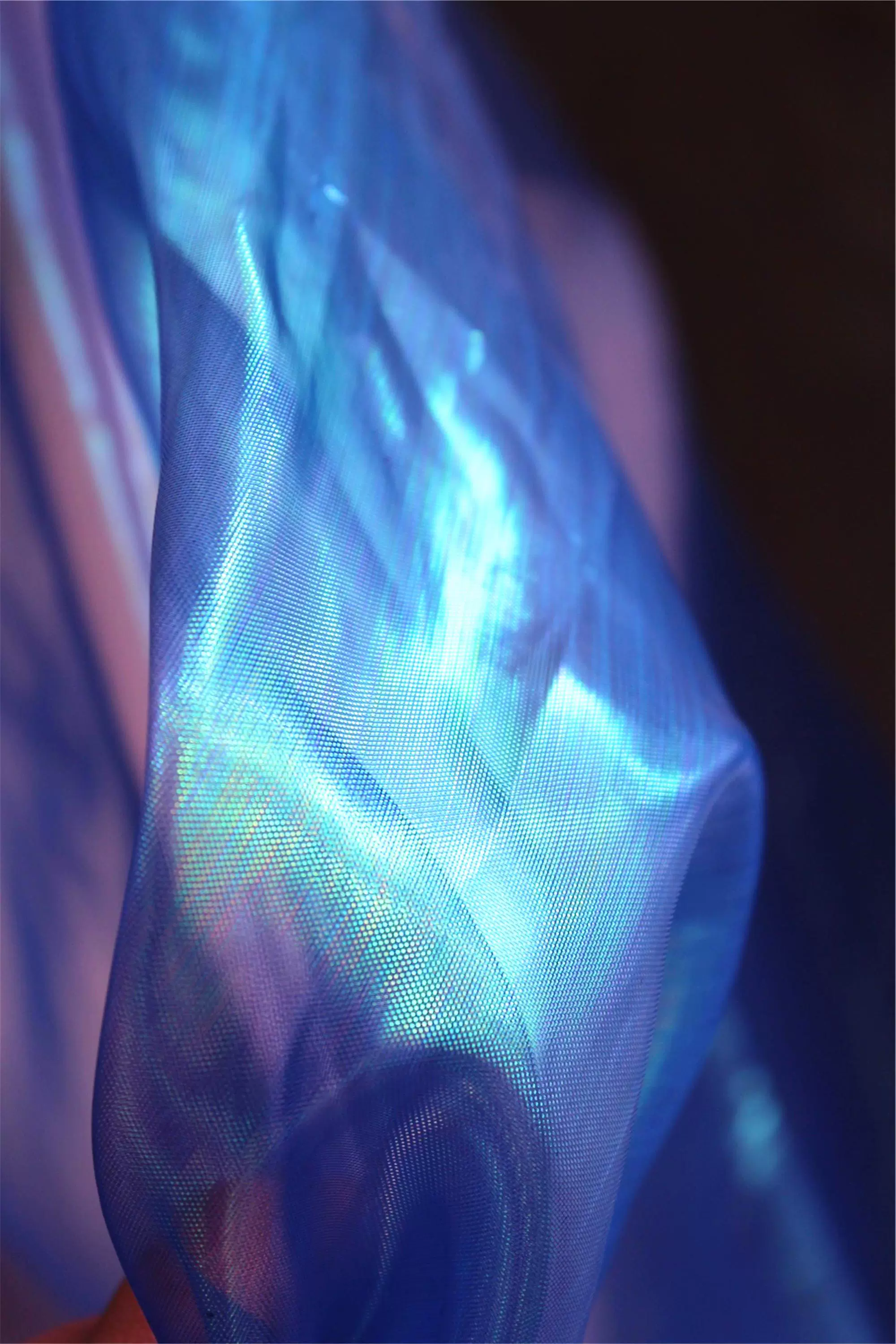 神秘蓝色绿光网纱进口透视七彩镭射服装布料连衣裙设计师幻彩面料