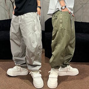 
Spring American trendy brand multi-pocket splicing scimitar casual pants for men, fashionable and versatile, loose and breathable, leg-tie harem pants