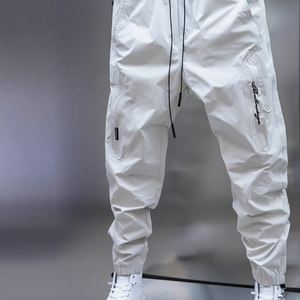 
Men's spring and summer new thin breathable casual pants solid color pocket decorative trousers elastic waist harem pants