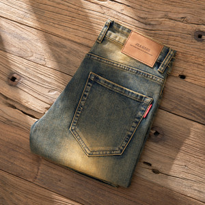 
European and American high-end retro old jeans men's elastic and fashionable men's slim feet long trousers spring and summer style