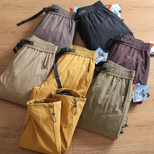 
Heavy-duty cold-proof pants! Windproof and water-repellent! Winter outdoor thickened warm down pants for couples duck down overalls