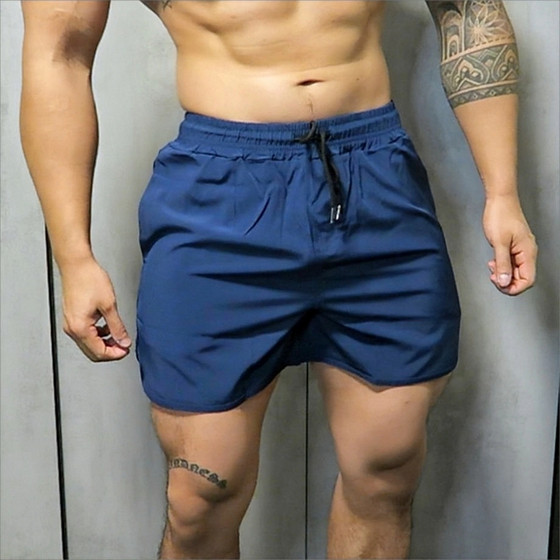 Sports fitness shorts Men's summer fast -drying, loose, breathable running solid color shorts fashion casual elastic quarter pants