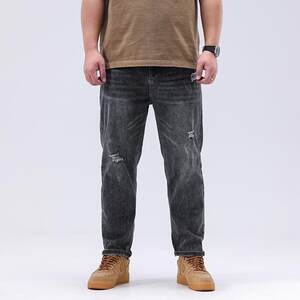 
Plus size men's summer new ripped jeans men's loose plus size stretch retro small feet nine-point jeans