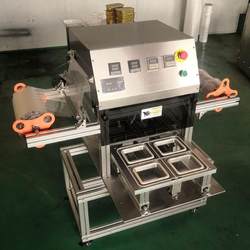Sauce box automatic sealing machine plastic barrel sealing machine juice yogurt cup fully automatic cup sealing machine packaging