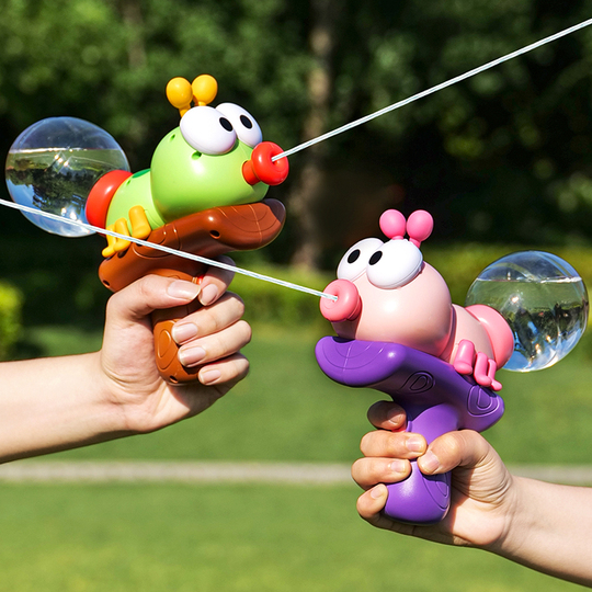 Green and pink ant-shaped water blasters in an outdoor water battle