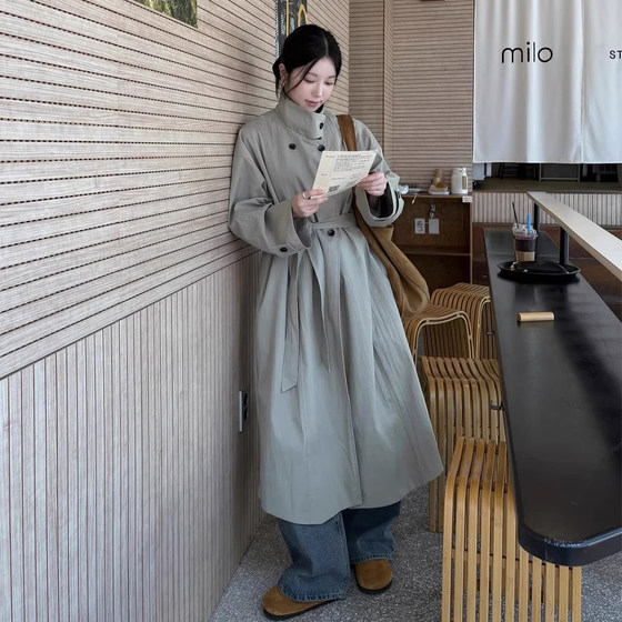 
High-end temperament stand-up collar double-breasted solid color windbreaker jacket for women autumn new style strap waist slimming long top