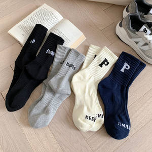 
Letter Korean version socks for women warm Japanese ins letters sports and casual girls socks for couples four seasons mid-tube socks