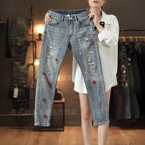 
Autumn and winter high-end men's jeans light blue hole patch splash ink painted personalized slim feet elastic trend