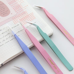 Colorful handbook tweezers macarons and washi tape stickers