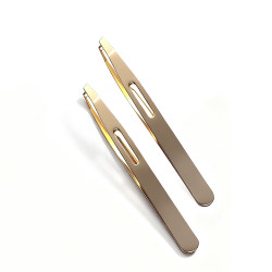 Gold eyebrow clip with slanted eyebrow tweezers