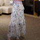 2025 summer new French irregular ruffle print vacation style fashionable age-reducing long skirt for women