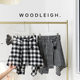 Spring new black and white plaid one-piece lace-up skirt straps covering the cross dance irregular tweed warm skirt